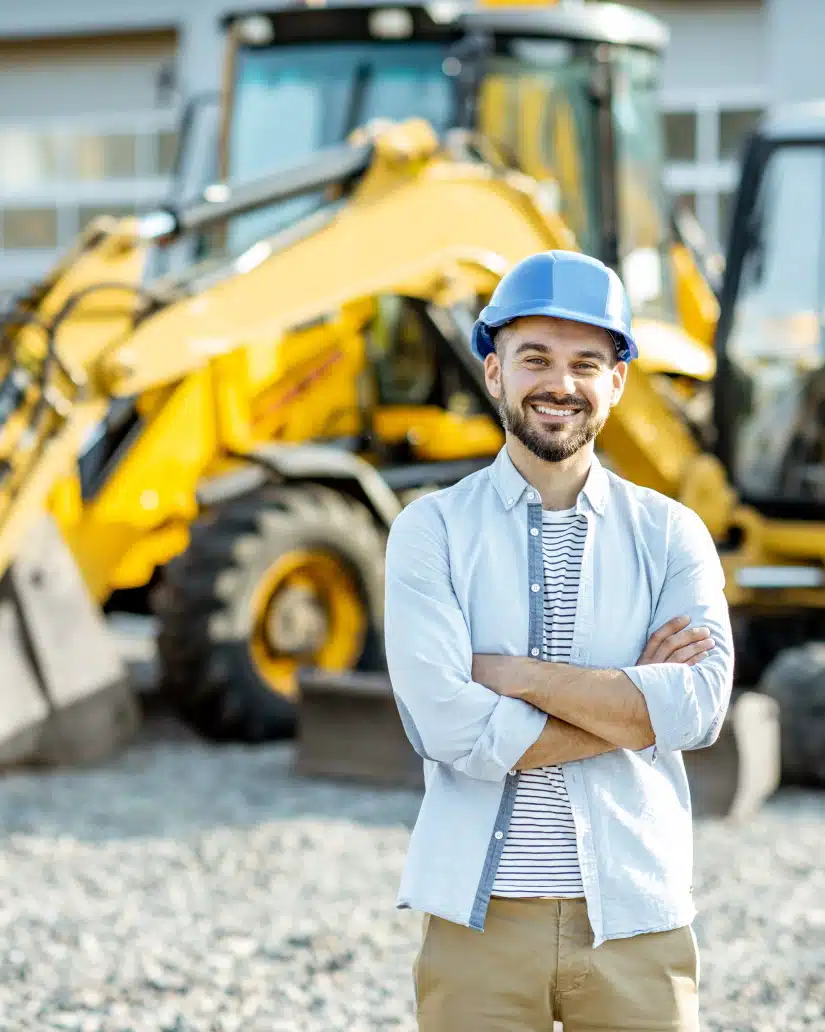 builder at the shop with heavy machinery       utc