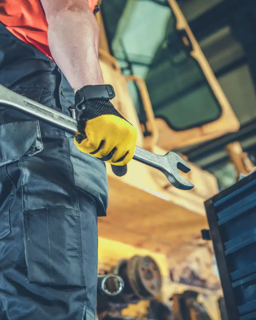 men fixing heavy machinery       utc