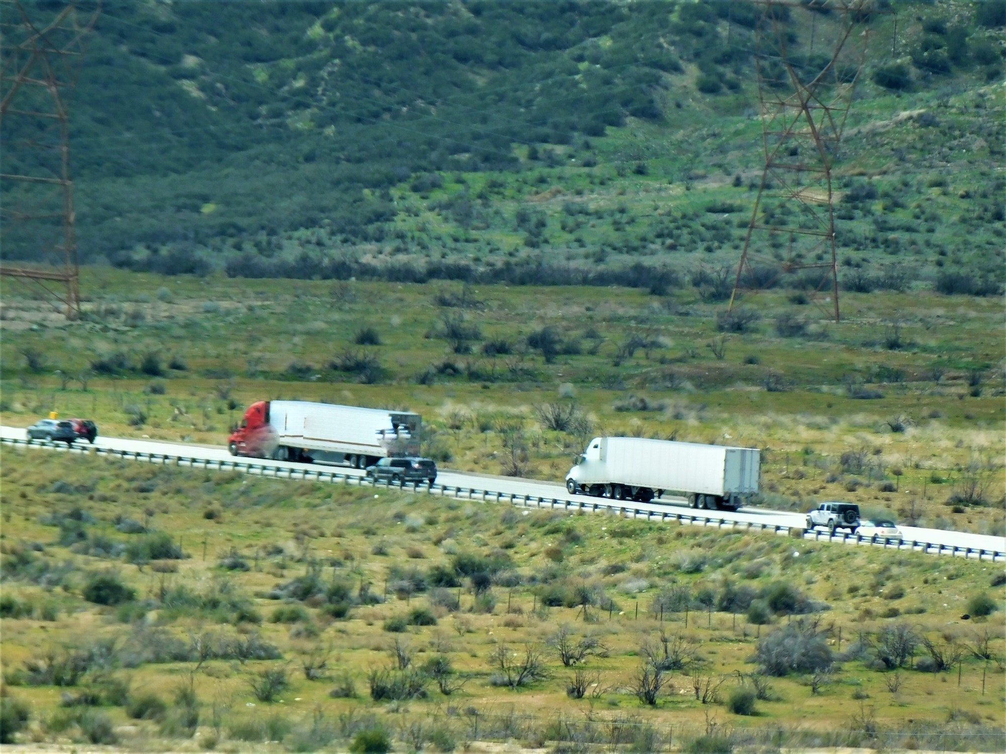 Transportation and Logistics! Long haul big rig semi trucks on an uphill grade!