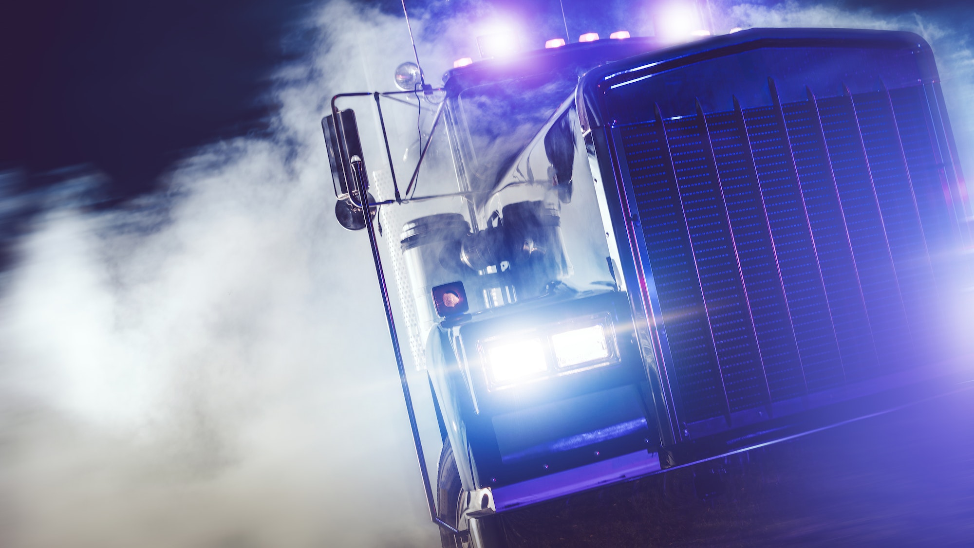 Semi Truck Drive Out of Smoke at Night