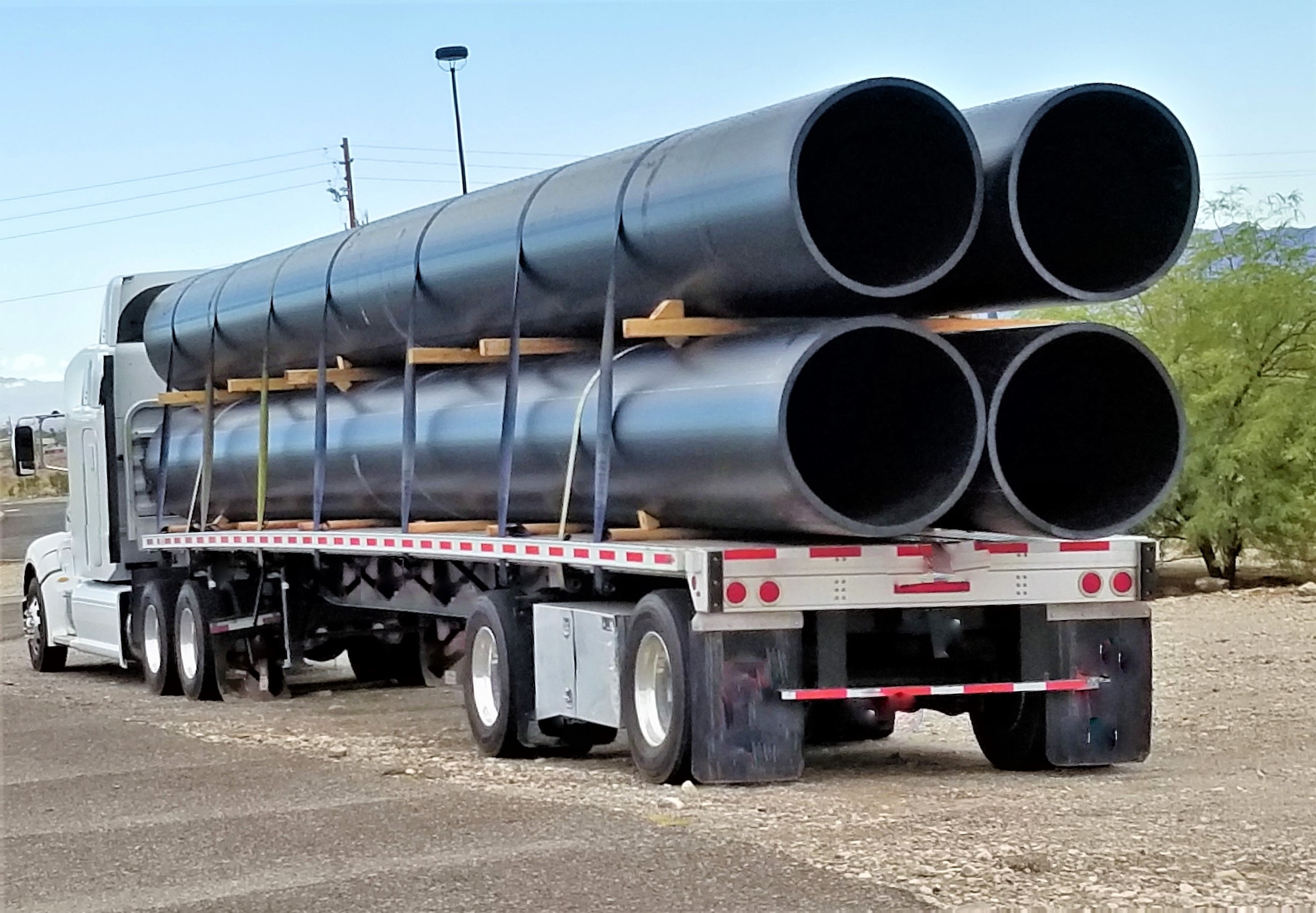 Transportation and Logistics! Hauling vinyl chloride) pipes