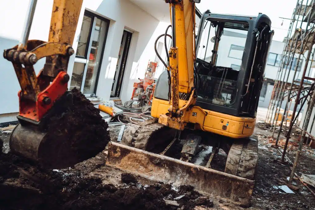 How to Load a Mini Excavator For Shipping 3 Construction site details with mini excavator digging and working.