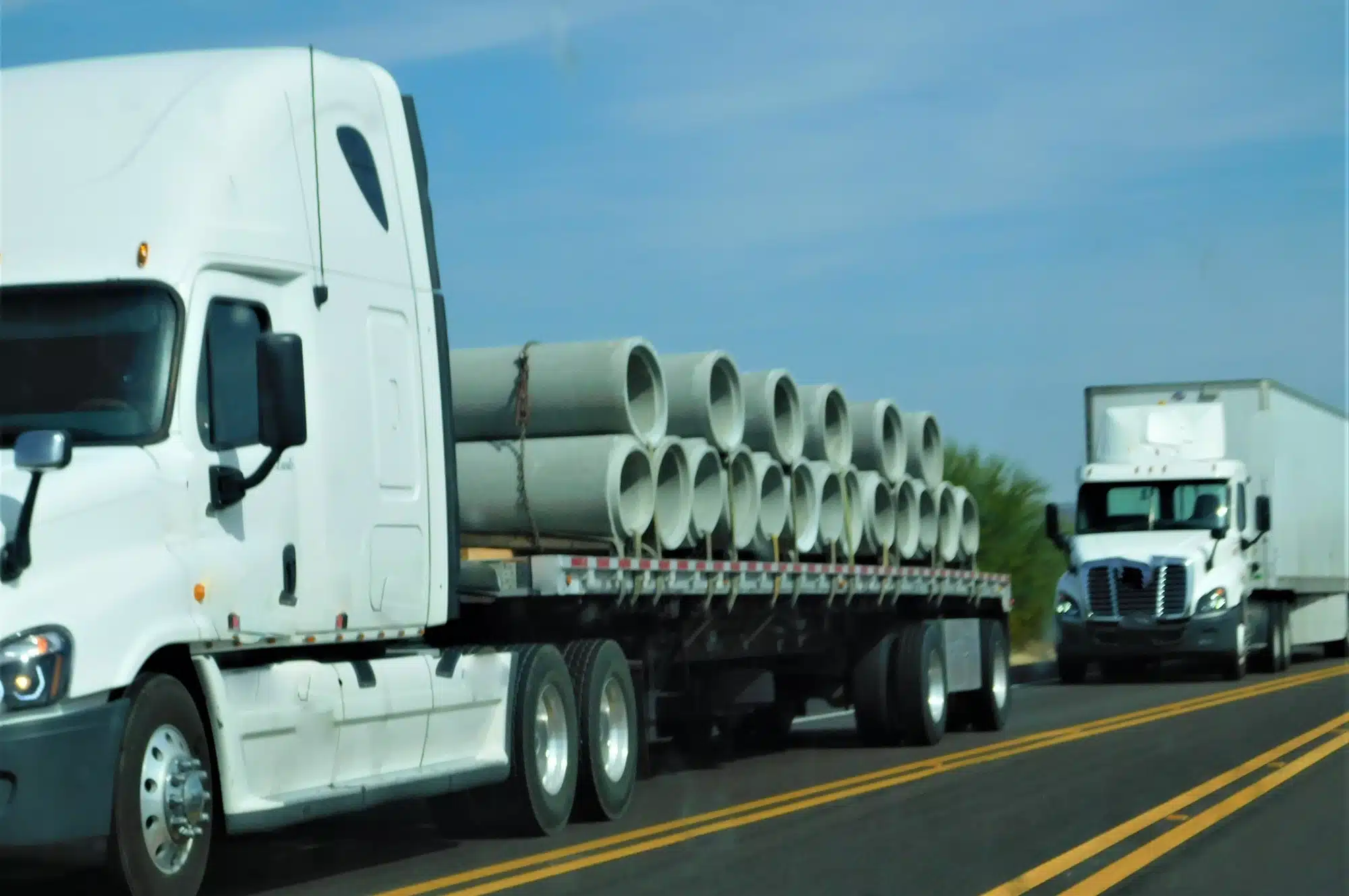 What is a Flatbed Trailer? Uses, Advantages and Features 3 Trucking! Hauling Cement Pipe!